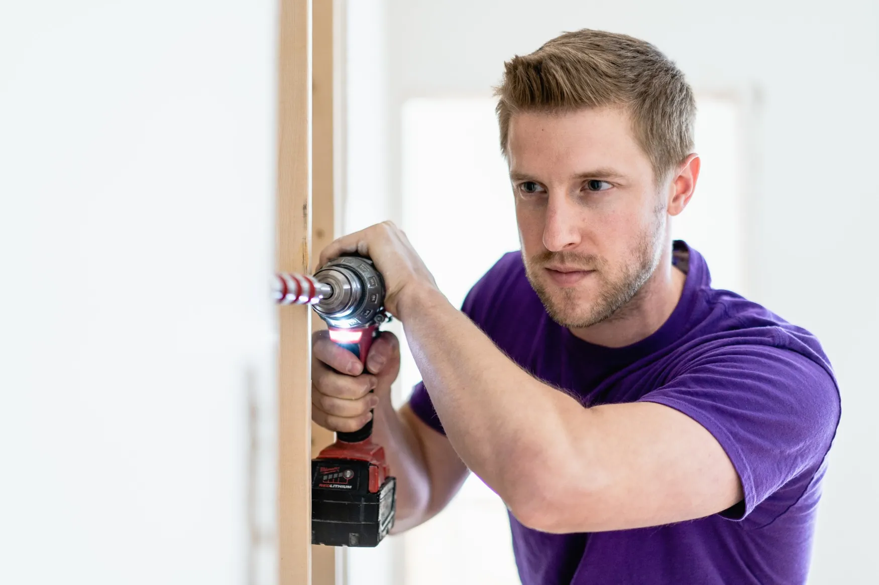 Paul of Brilliant Electric drilling framing during electrical installation work